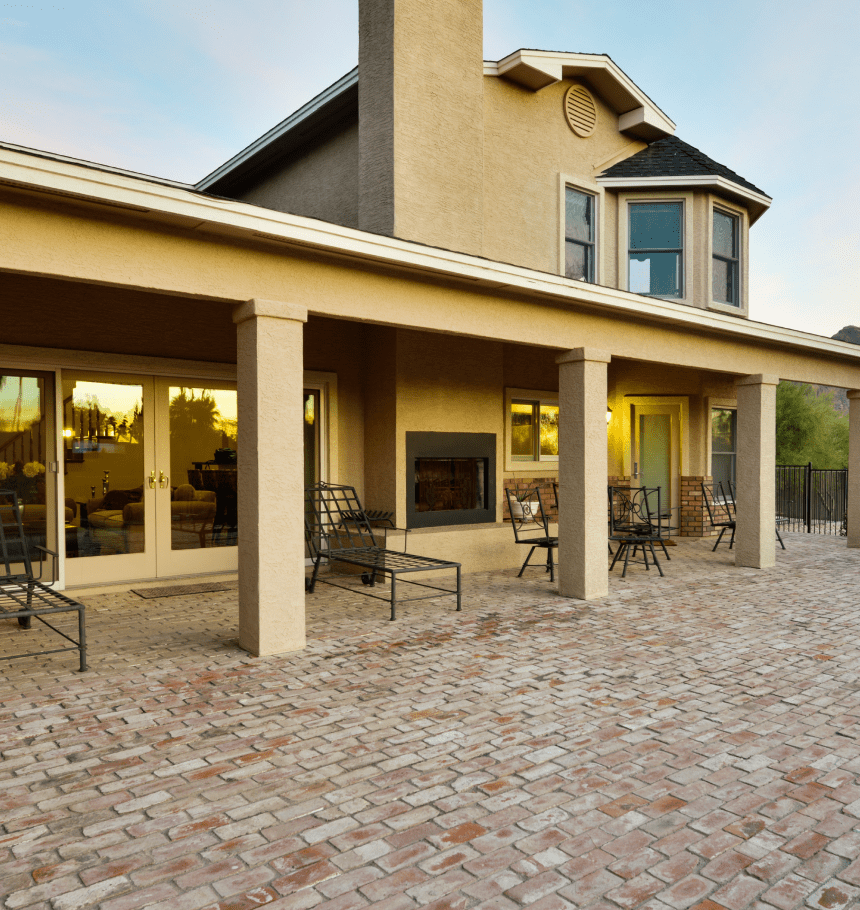 Brick patio with covered seating area.