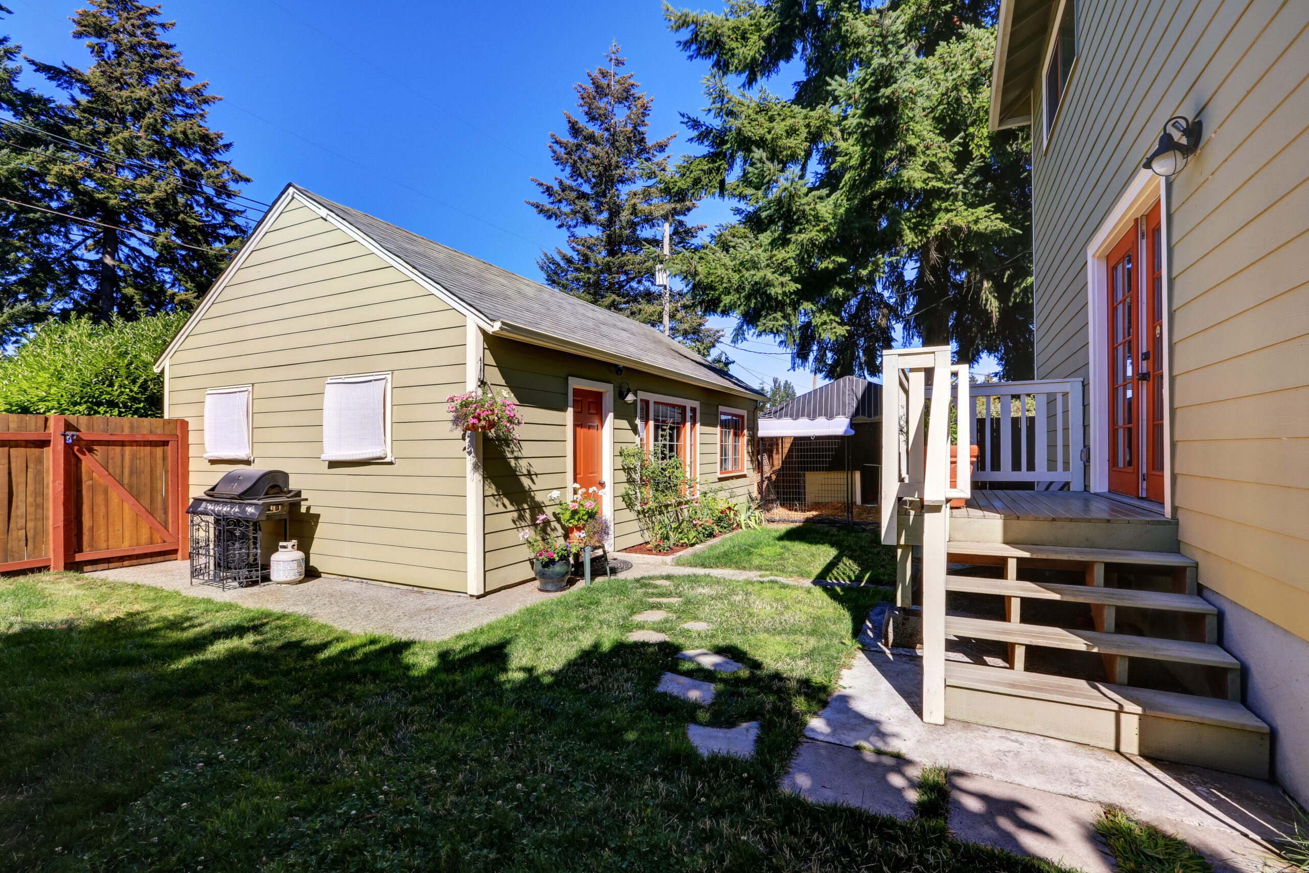 Backyard view of craftsman house with a shed. Northwest, USA